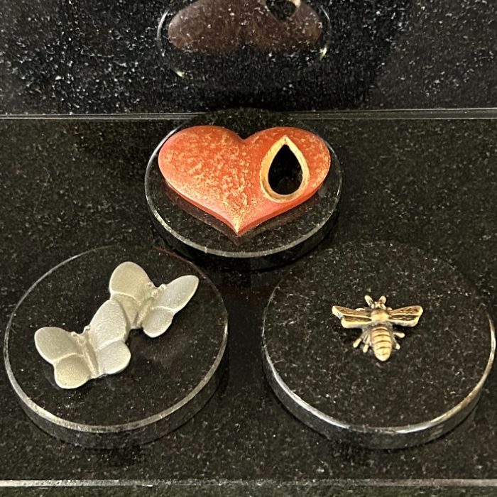 Painted bronze heart, bronze Manchester Bee and bronze butterflies