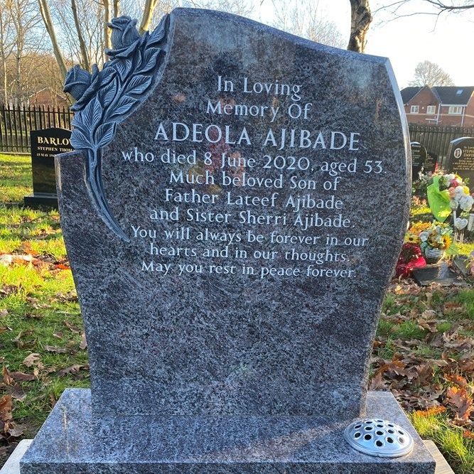 Bahama blue headstone with deep carved roses and silver lettering in Agecroft Cemetery