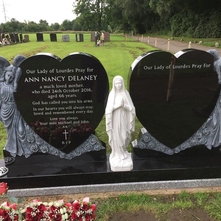 Double black granite memorial with matching carved standing angels