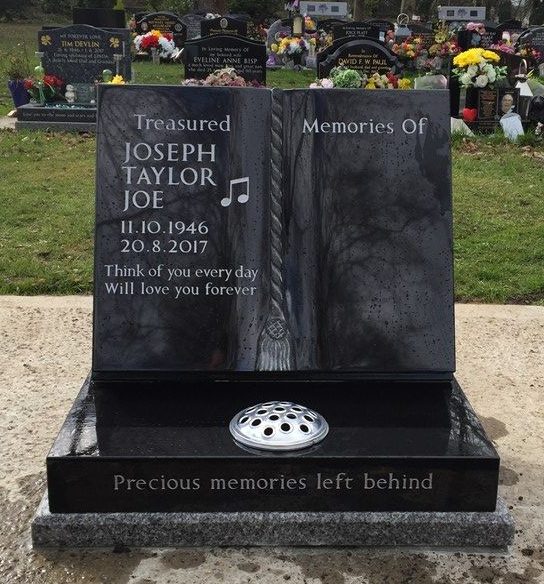 Black granite cremation book memorial with cord and tassel and musical notes