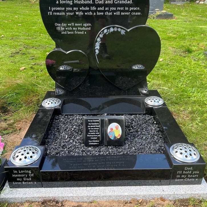 Granite kerbset with vase posts and black chippings on a 3 heart memorial